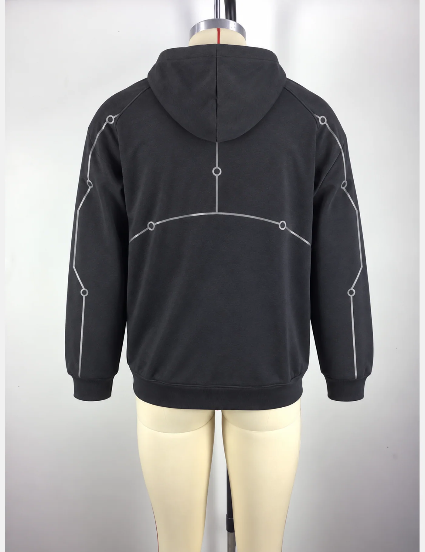 Actual reflective circuit-piping half-zip hoodie sample shown from the back on a mannequin