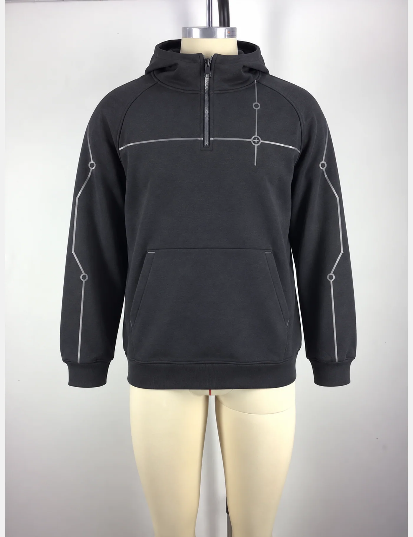 Actual reflective circuit-piping half-zip hoodie sample shown from the front on a mannequin