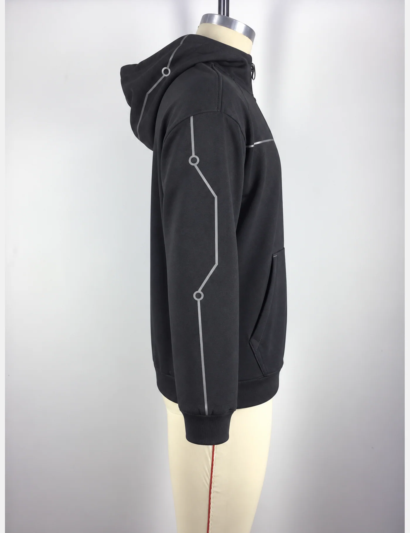 Actual reflective circuit-piping half-zip hoodie sample shown from the side on a mannequin
