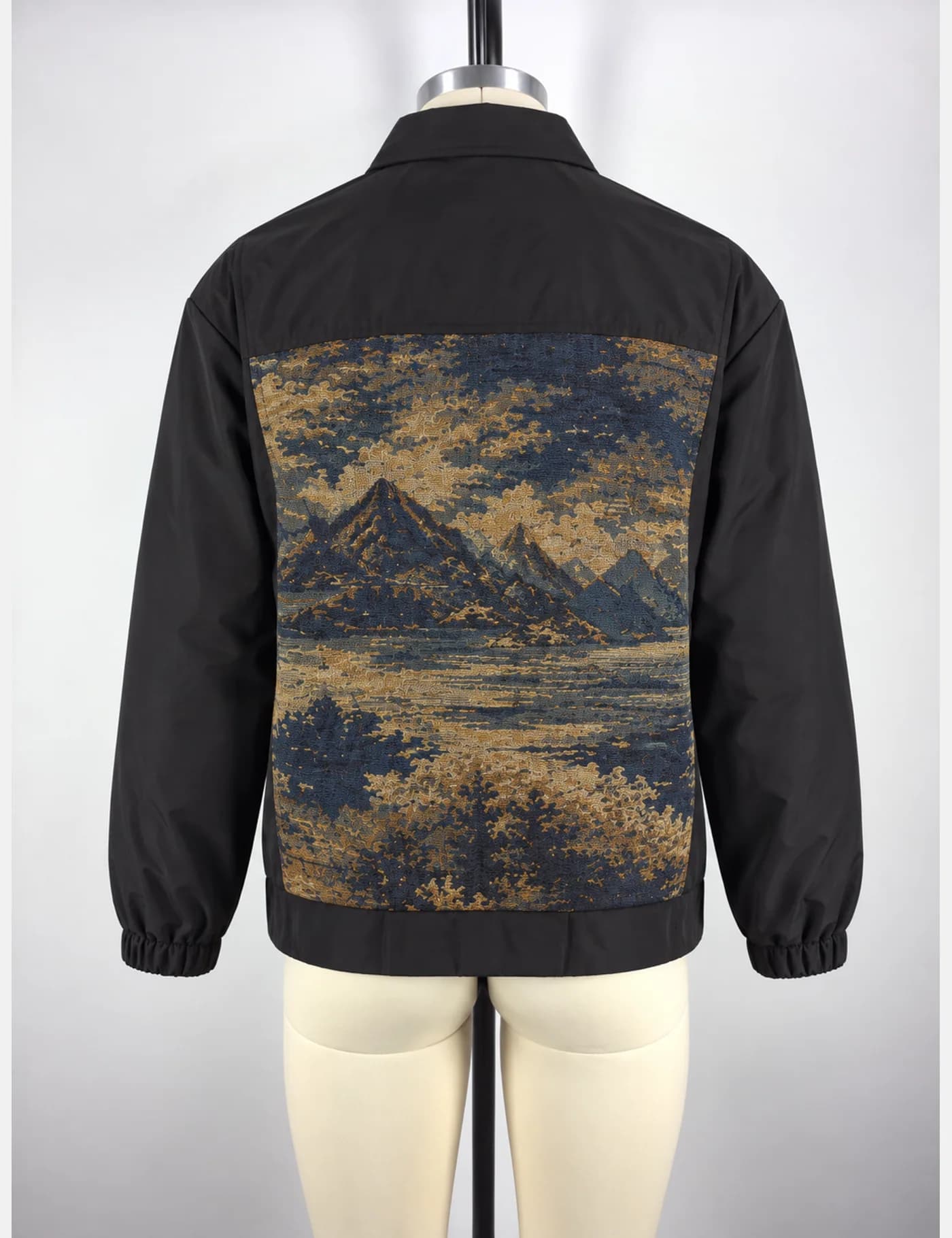 Actual tapestry landscape-panel coach jacket sample shown from the back on a mannequin