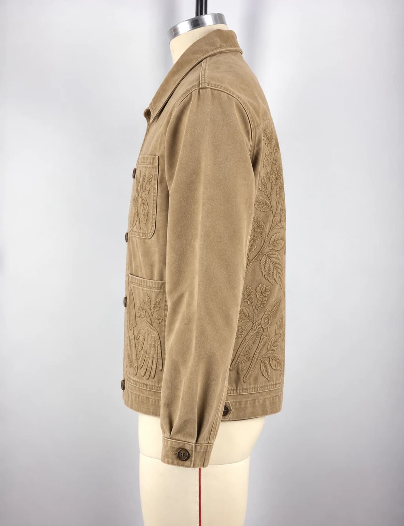 Actual tonal embroidery chore jacket sample shown from the side on a mannequin