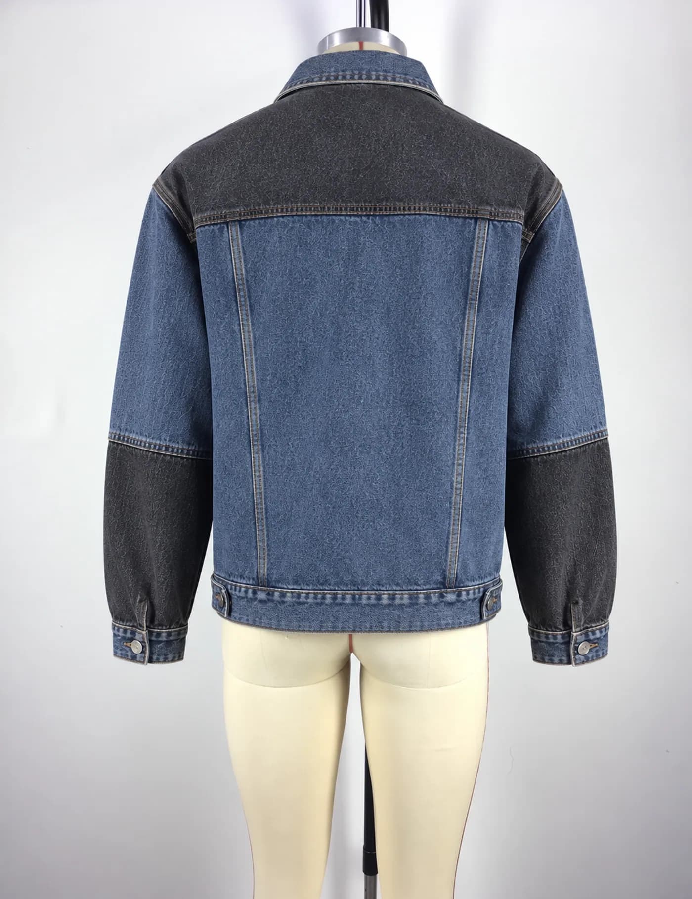 Actual two-tone denim trucker jacket sample shown from the back on a mannequin