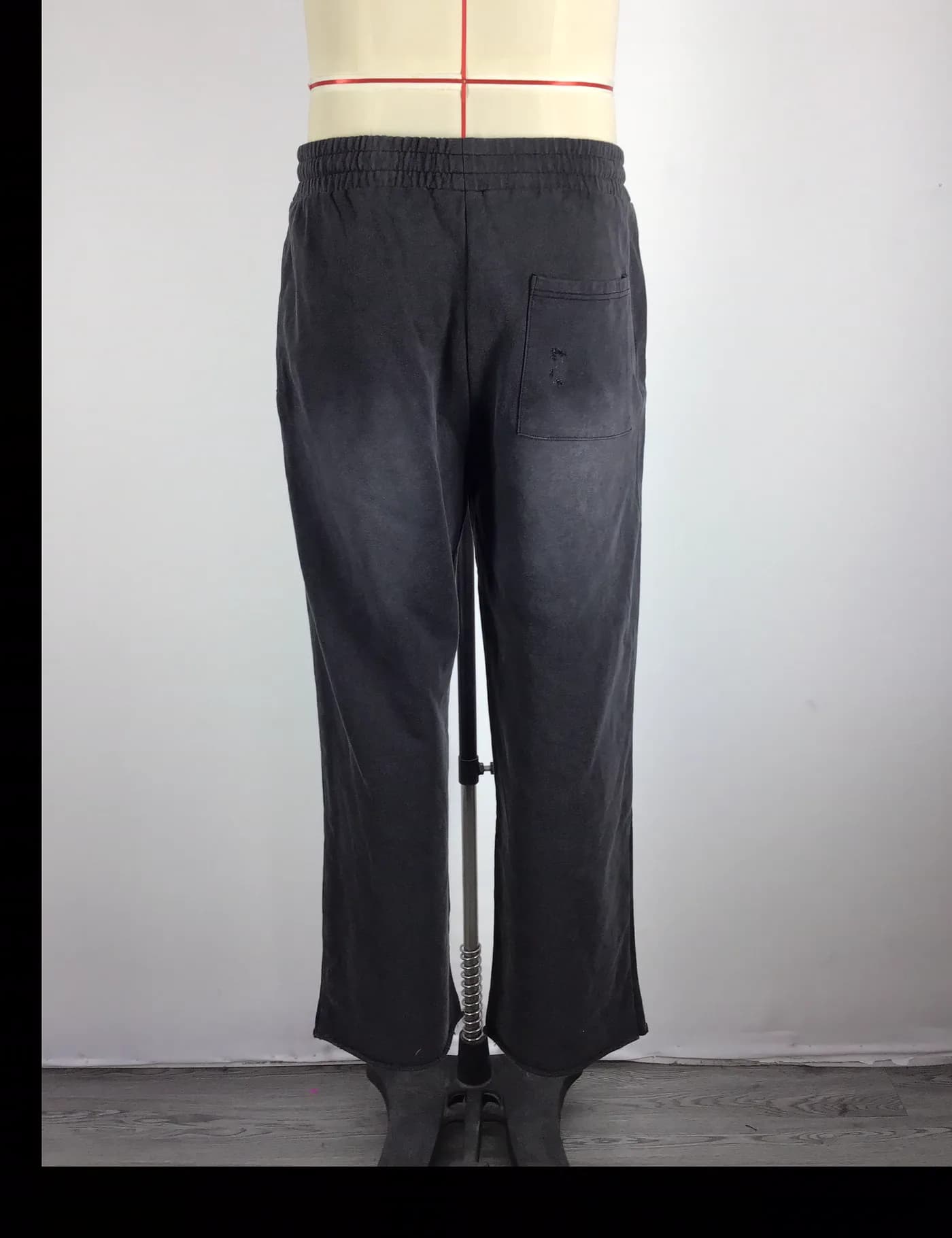 Actual vintage washed straight-leg sweatpants sample shown from the back on a mannequin