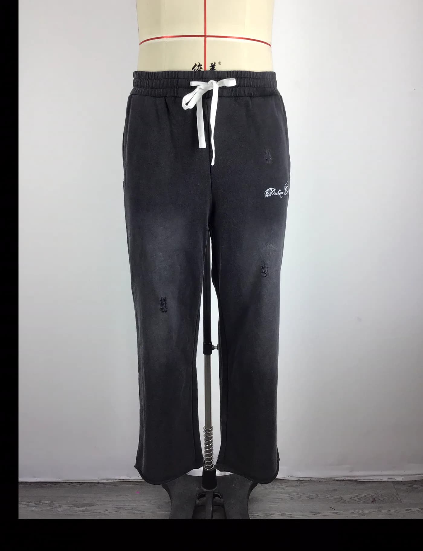 Actual vintage washed straight-leg sweatpants sample shown from the front on a mannequin