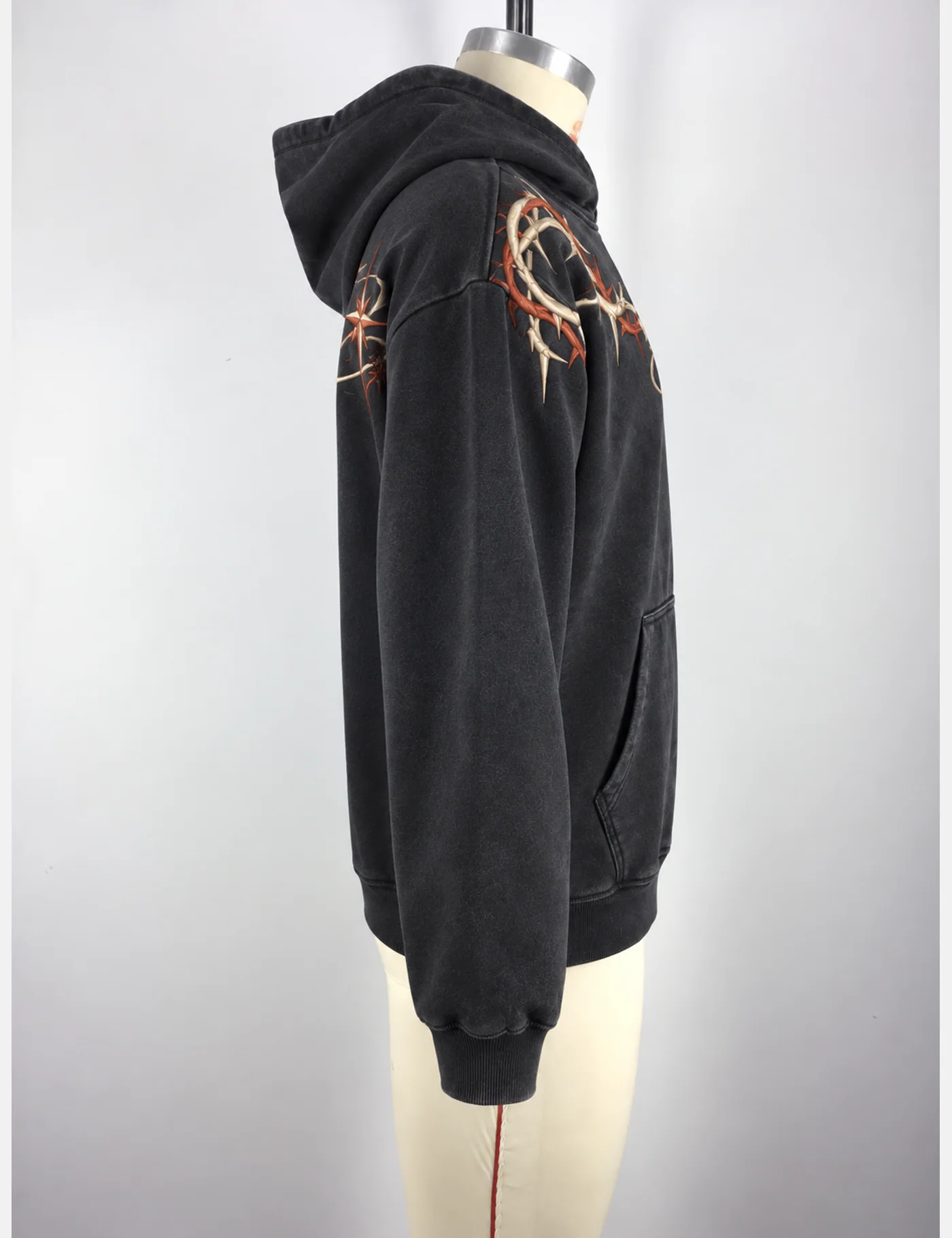 Actual washed barbed-vine embroidered hoodie sample shown from the side on a mannequin
