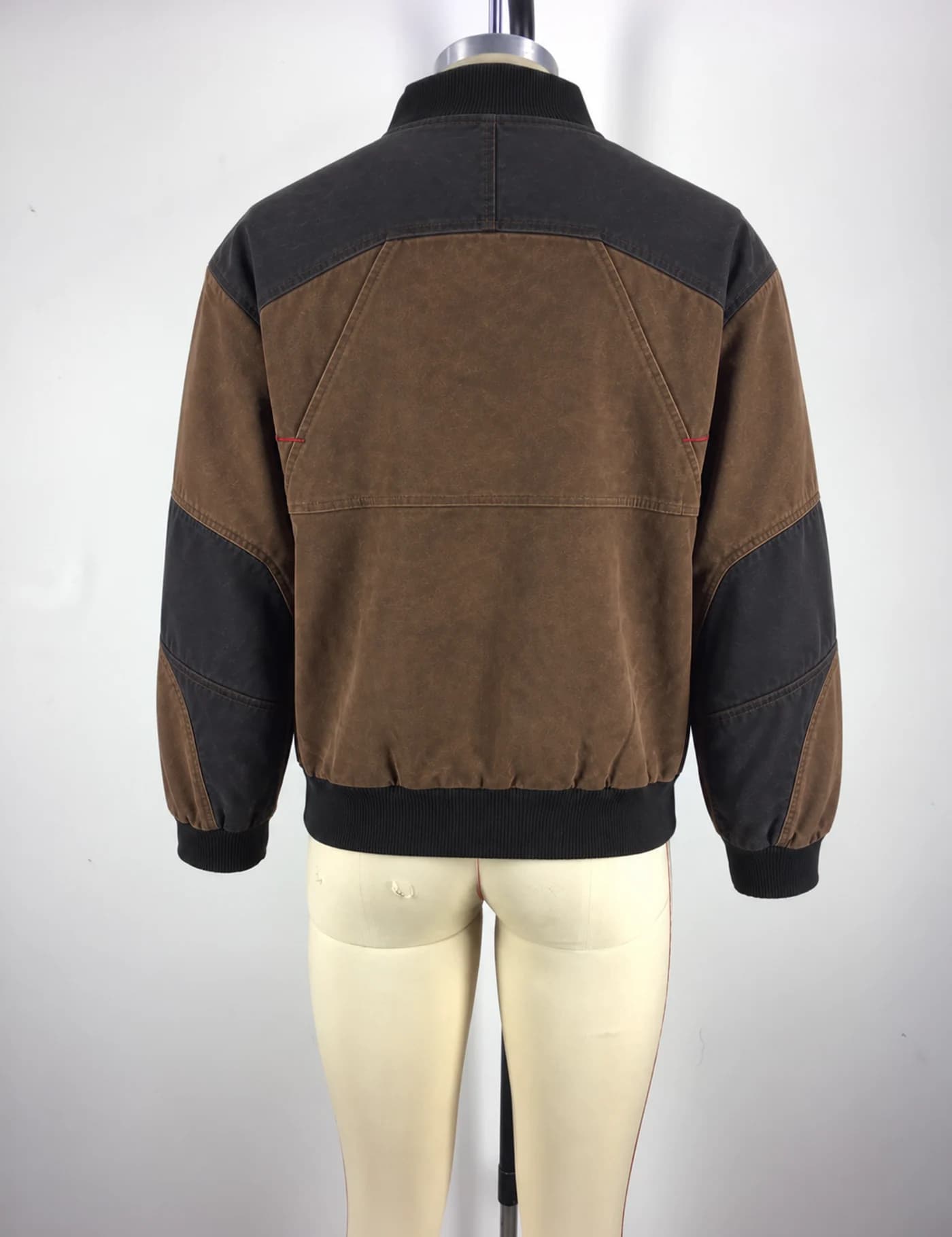 Actual washed color-block utility bomber jacket sample shown from the back on a mannequin