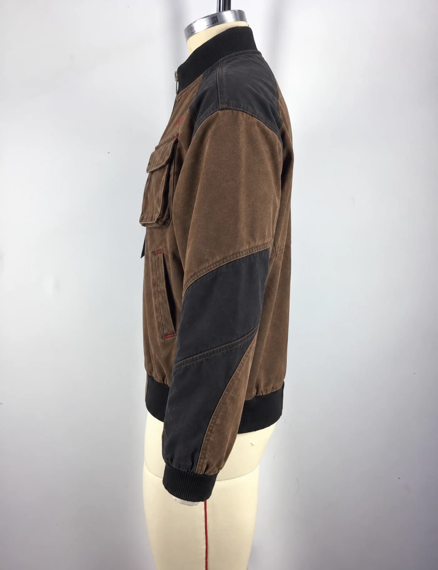 Actual washed color-block utility bomber jacket sample shown from the side on a mannequin