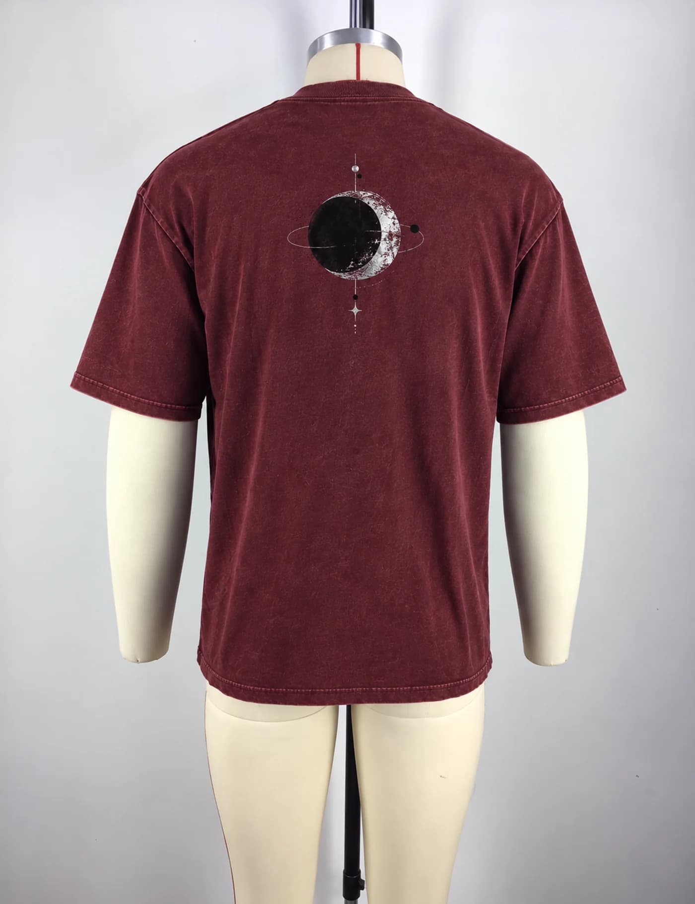 Actual washed planet graphic oversized t-shirt sample shown from the back on a mannequin