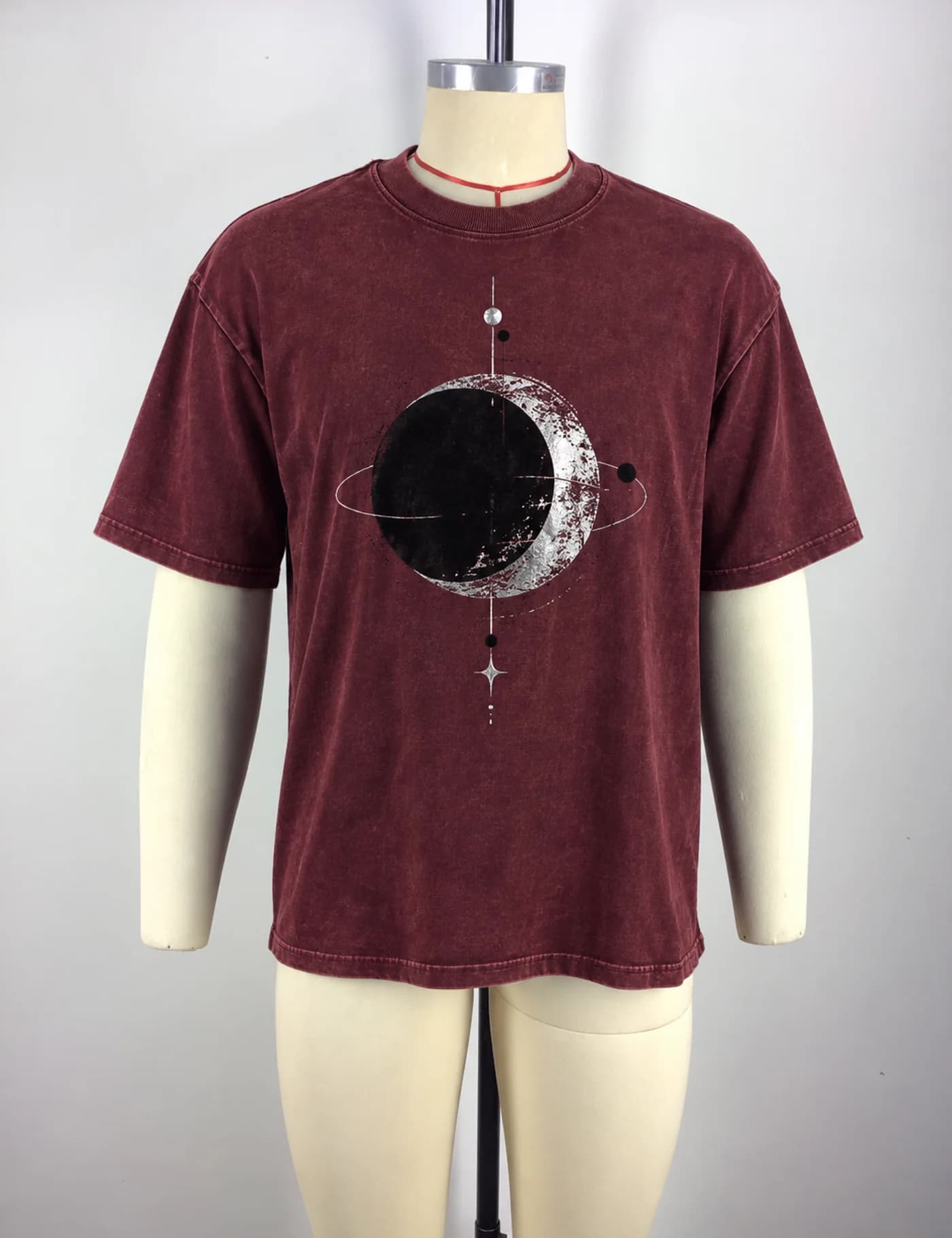 Actual washed planet graphic oversized t-shirt sample shown from the front on a mannequin