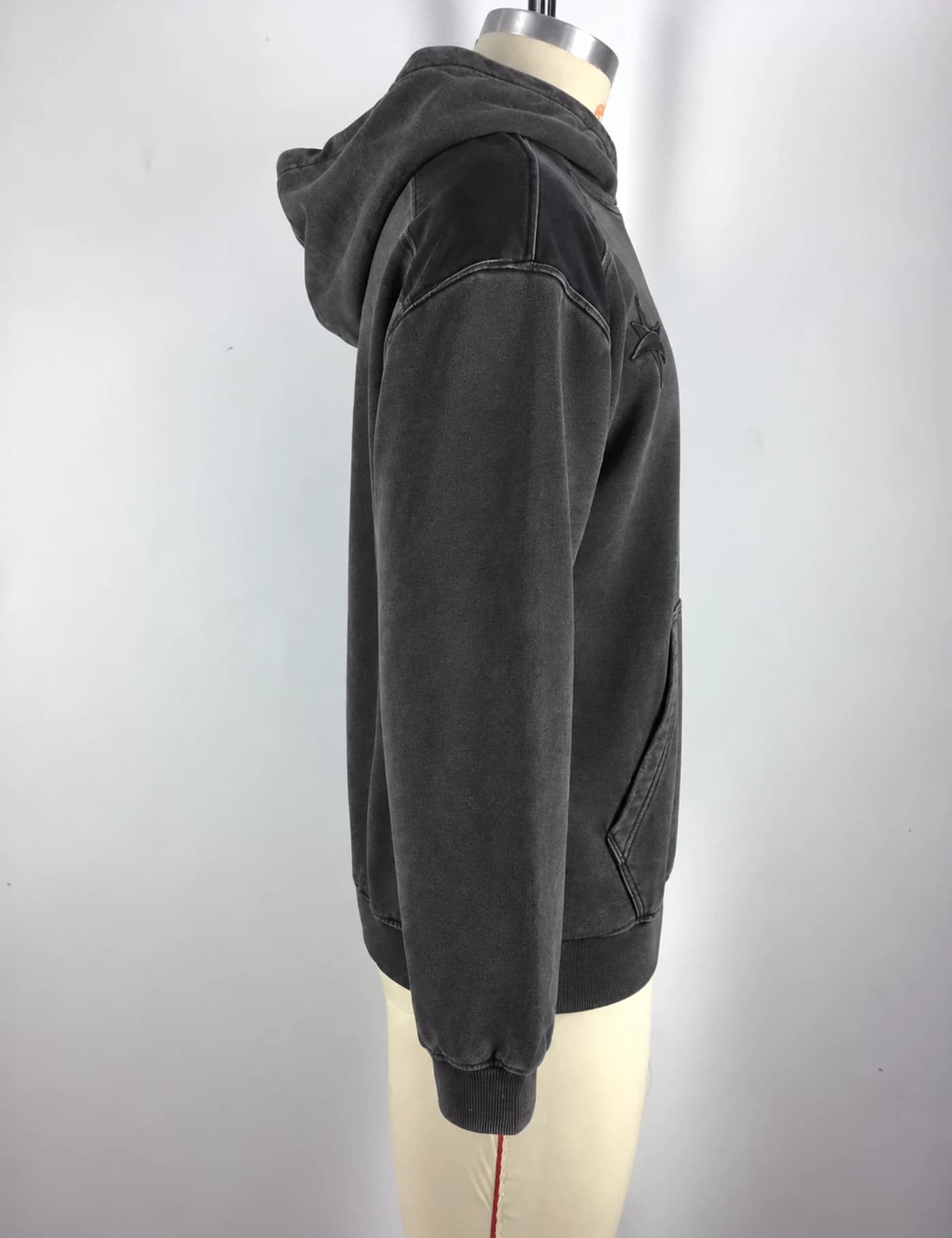Actual washed tonal embroidered pullover hoodie sample shown from the side on a mannequin