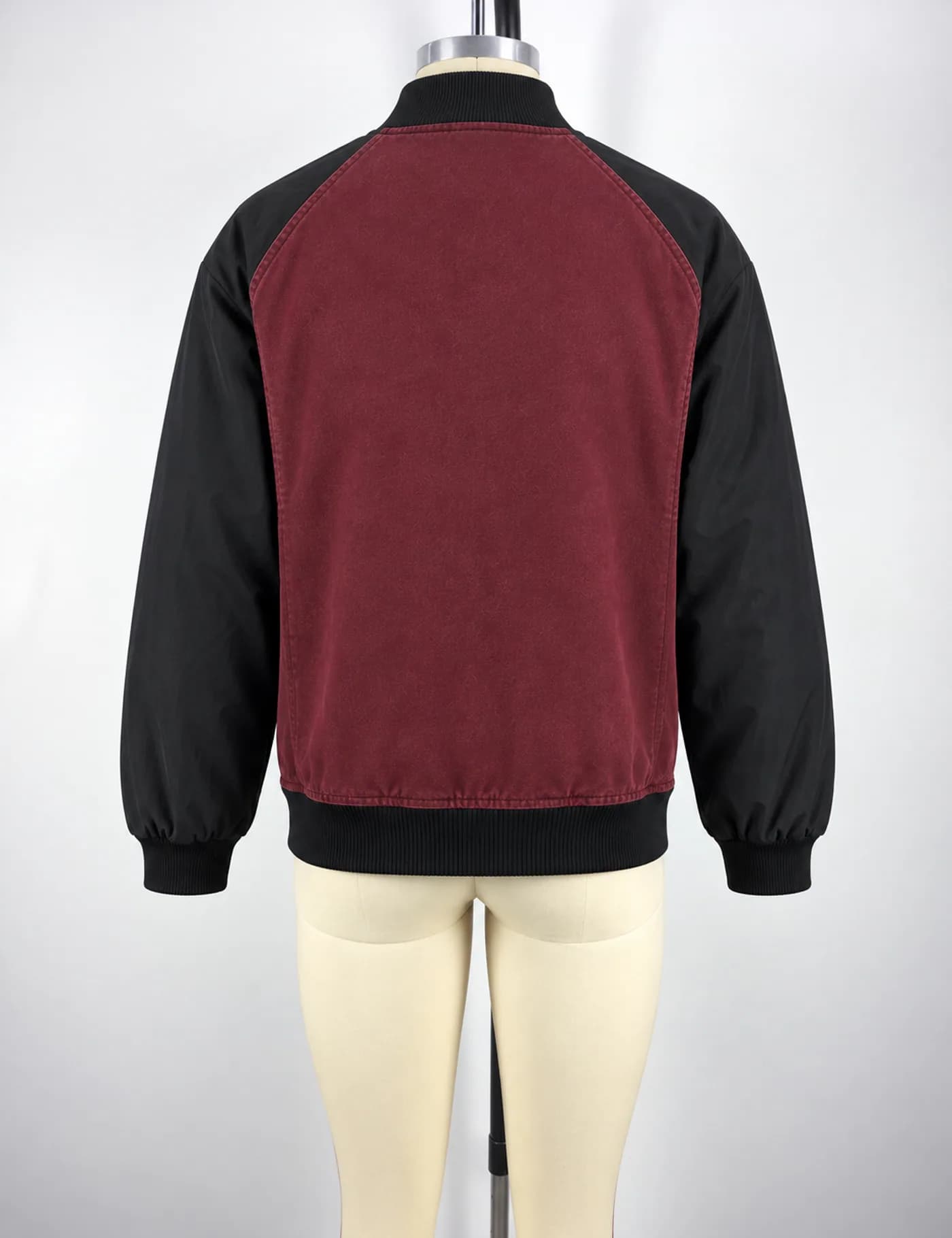Actual washed two-tone raglan bomber jacket sample shown from the back on a mannequin