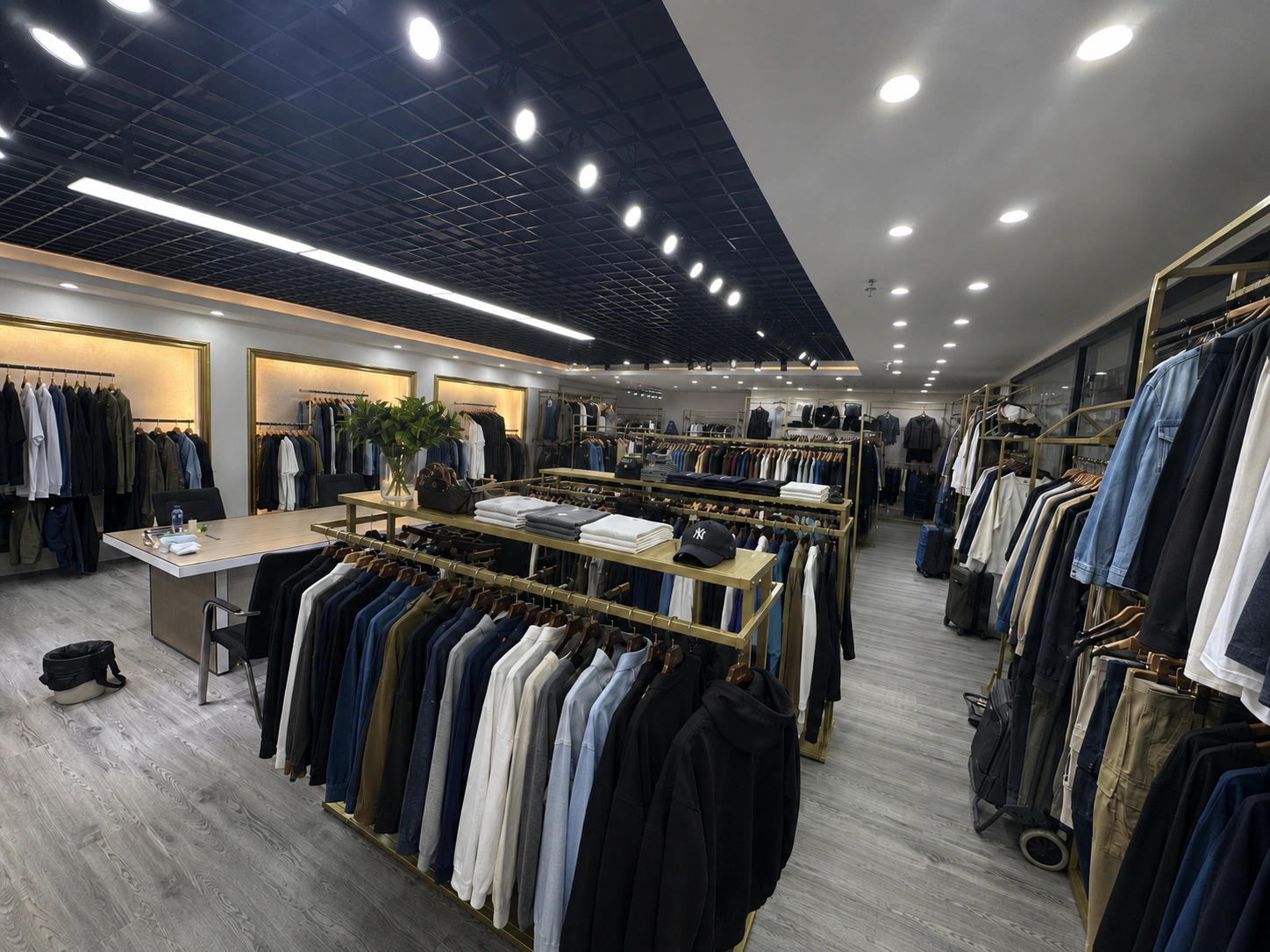 Kaouyou menswear sample showroom with custom T-shirts hoodies jackets and trousers